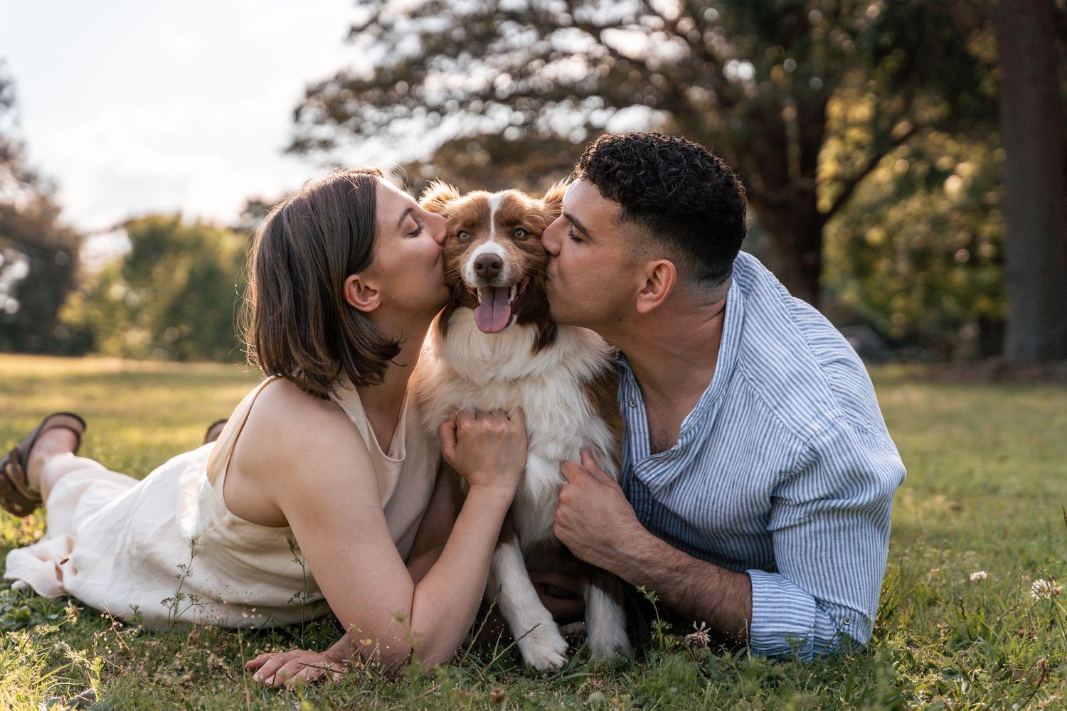 Couple kissing their dog during a photoshoot in Sydney
