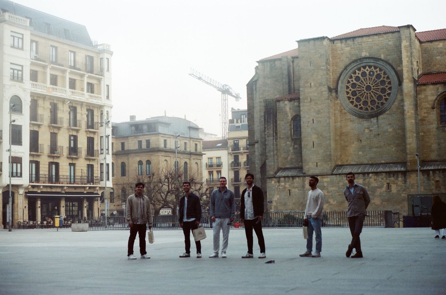 Panoramic view of a historic European town square with classic architecture and stone buildings.