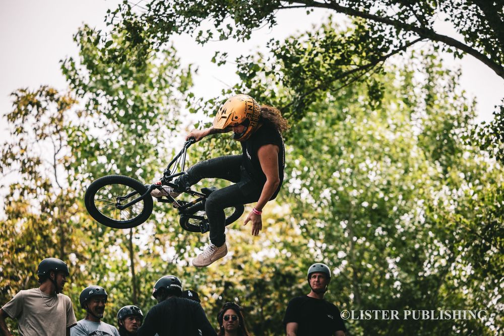 Action shots of BMX bike tricks and jumps in a sunny outdoor setting.