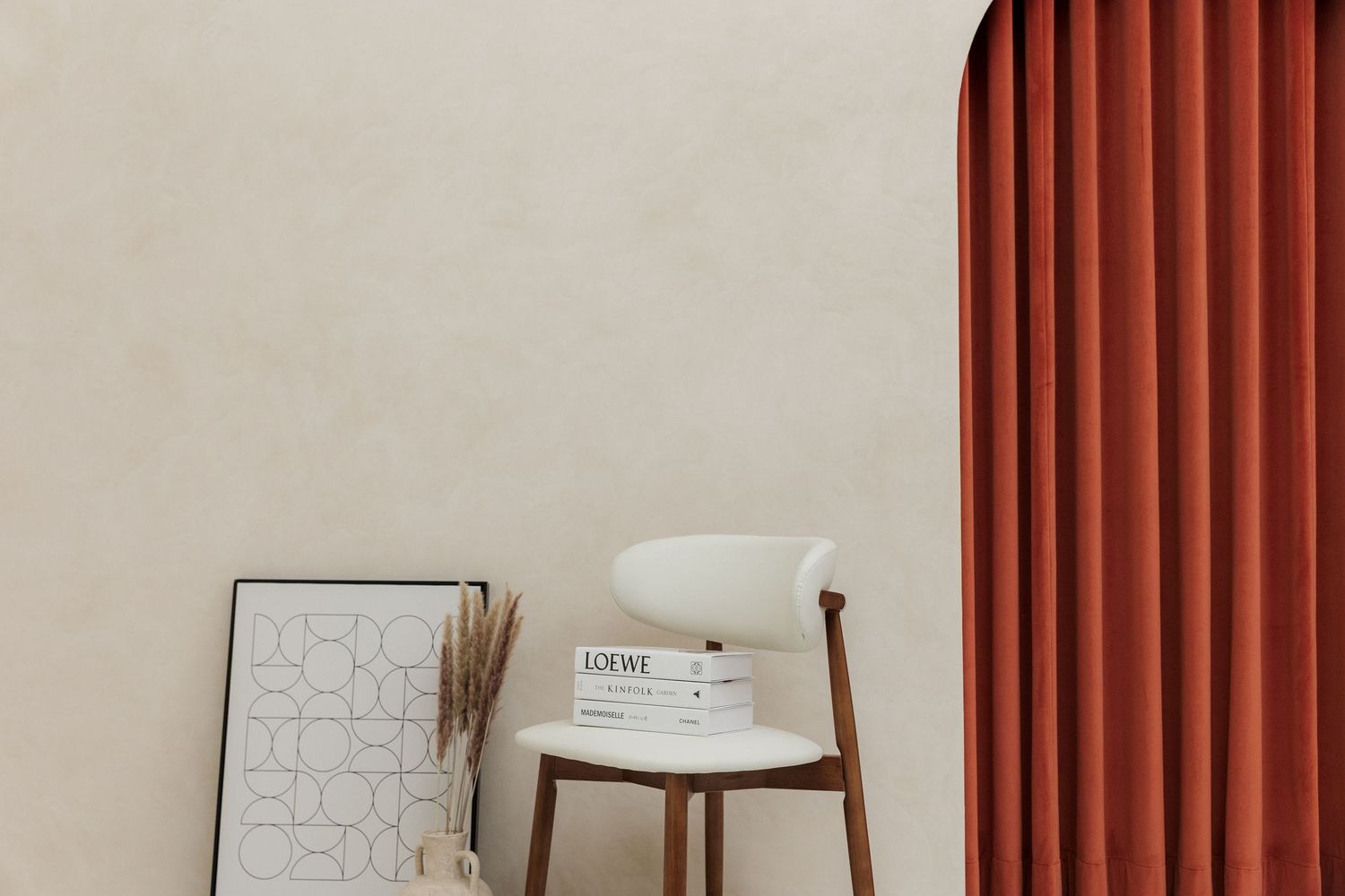 Modern minimalist living room with white sofa, brown curtains, and decorative wooden elements.