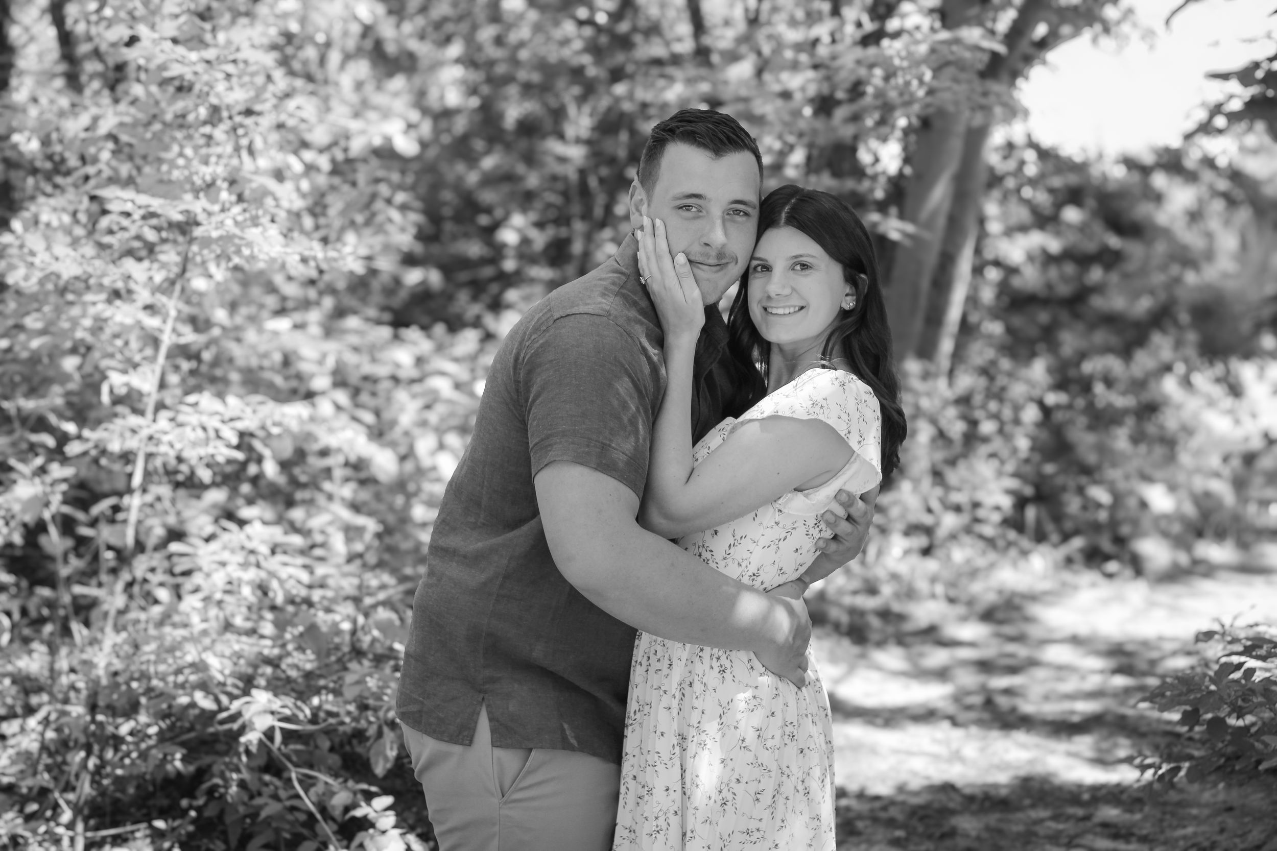 Couple shares candid moments during outdoor photo session.