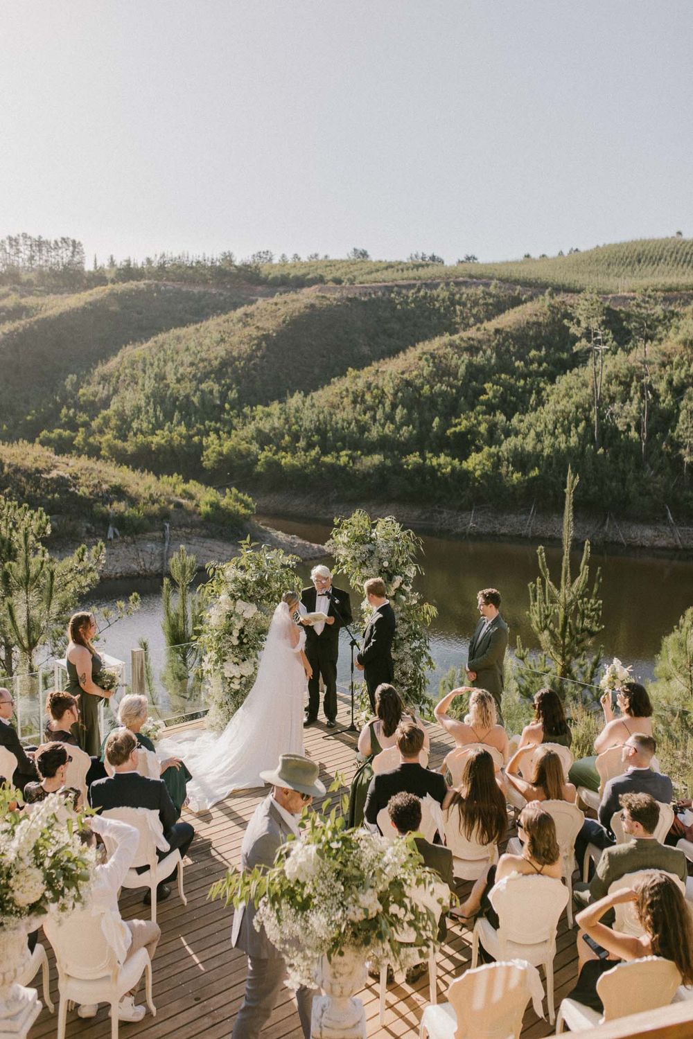 Luxury outdoor ceremony setup with floral arch — fine art wedding photography