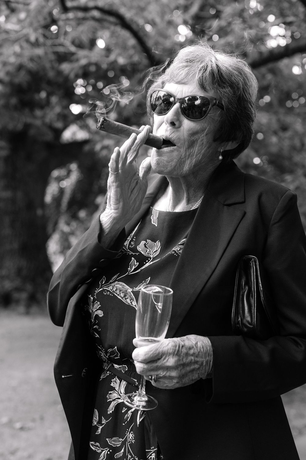 Black and white photo sequence showing someone in dark clothing drinking from a glass outdoors.