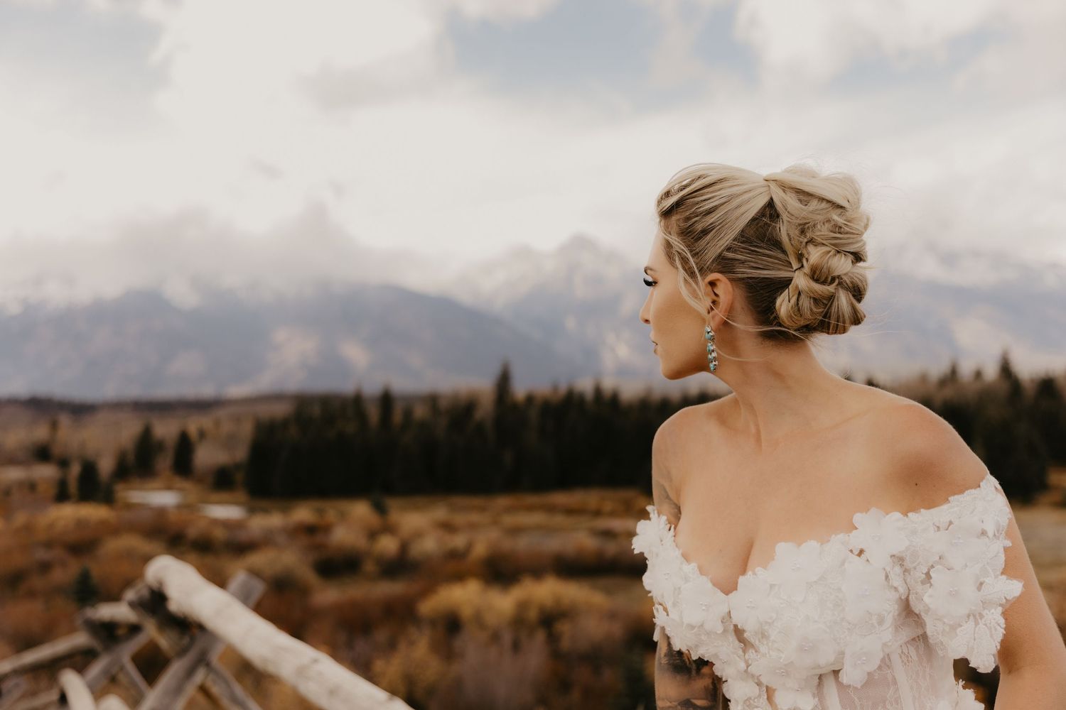 A dreamy portrait in front of the Eiffel Tower featuring warm tones and delicate tulle fabric.