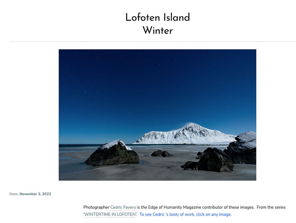 Snow-covered Lofoten Islands shoreline at dusk with mountain peaks and deep blue winter sky reflected on icy waters.