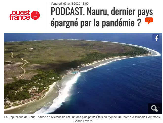 Aerial view of Nauru's coastline showing the narrow strip of land between ocean and inland terrain.