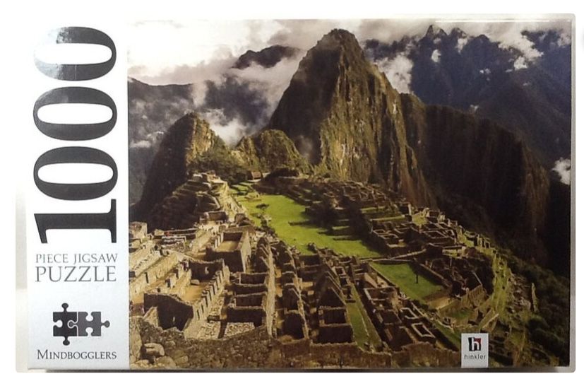 A 1000 piece jigsaw puzzle box featuring the ancient Incan ruins of Machu Picchu surrounded by misty mountains.