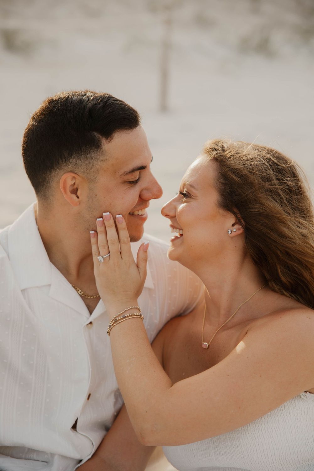 Close-up romantic shots of couple sharing intimate moments on the beach.