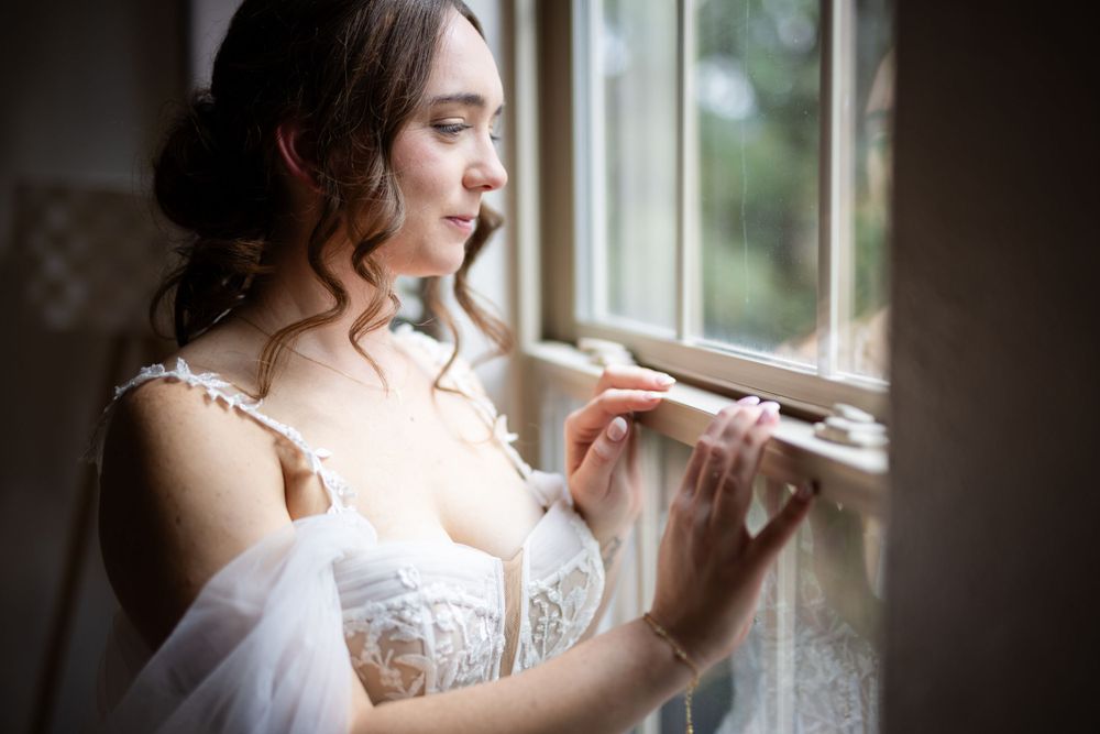Bride in soft natural window light on her wedding day in Eureka Springs, Arkansas