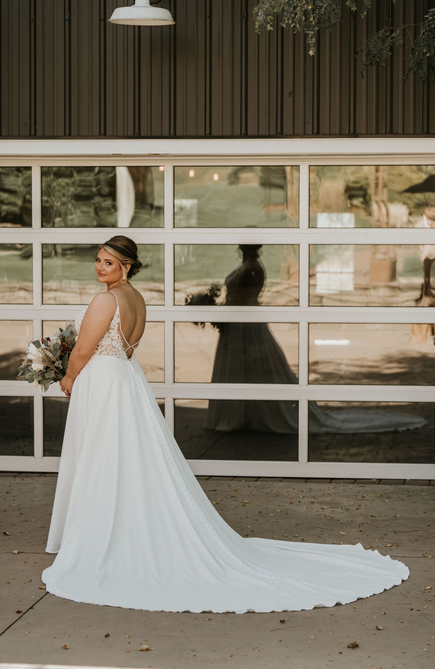 Bride standing in her wedding dress