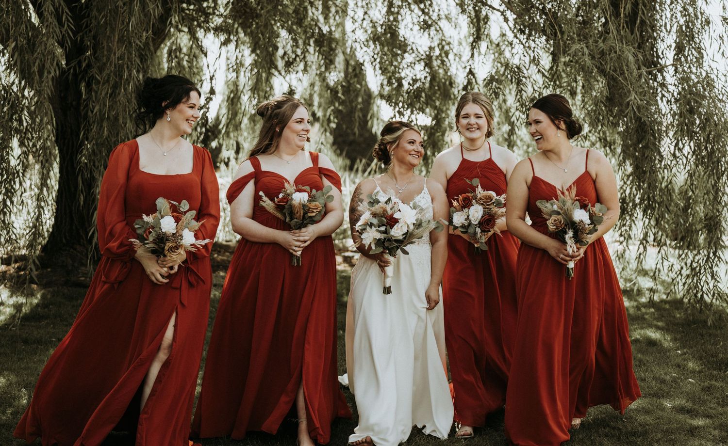 Bride and her bridesmaids walking and enjoying the wedding.