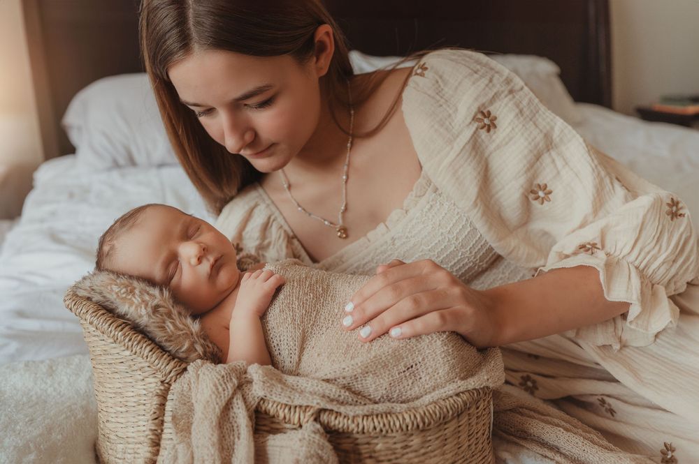 Family bonding with newborn and older siblings during an in-home lifestyle session