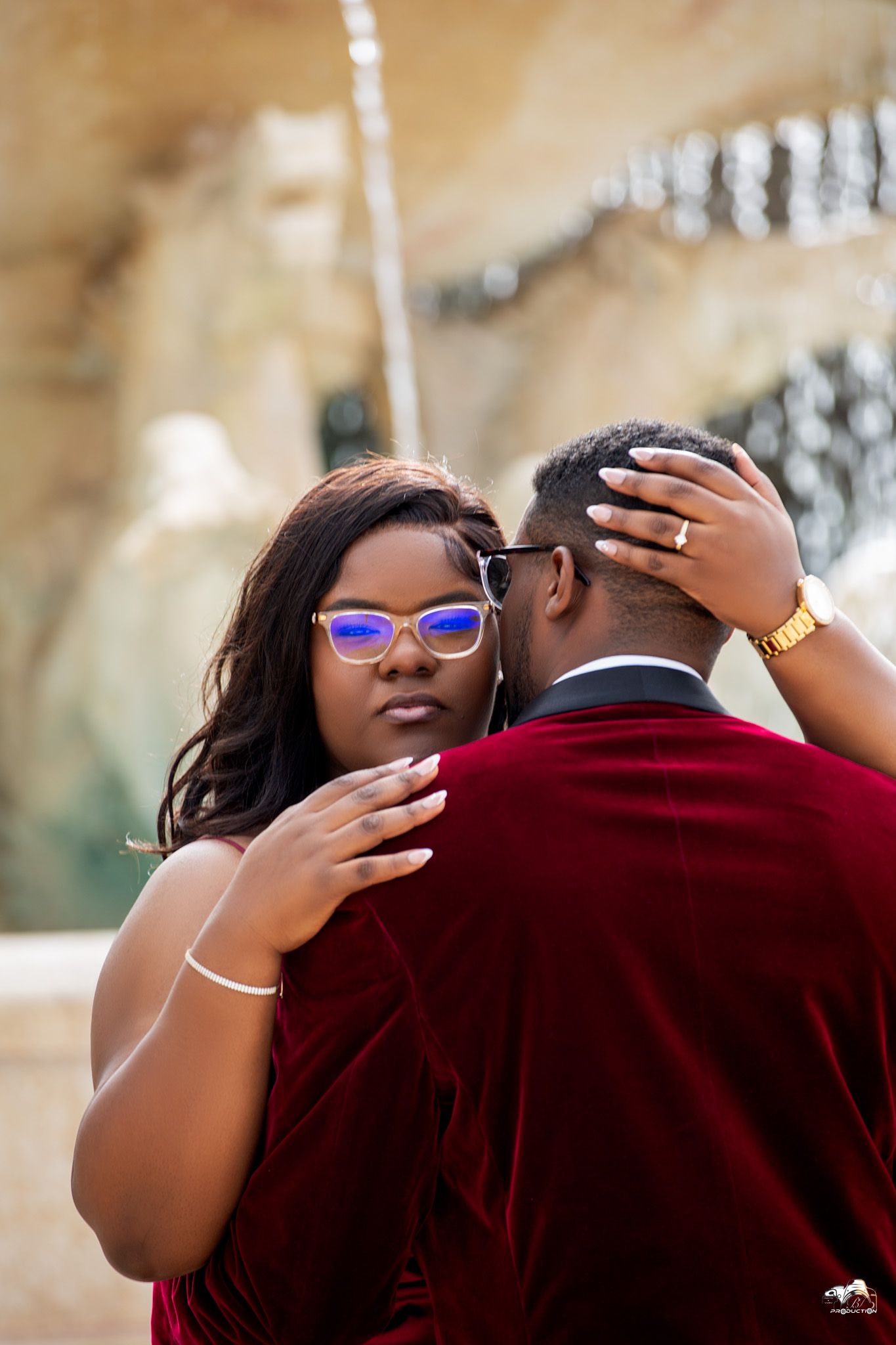 Intimate romantic portrait of couple embracing during outdoor photo session.