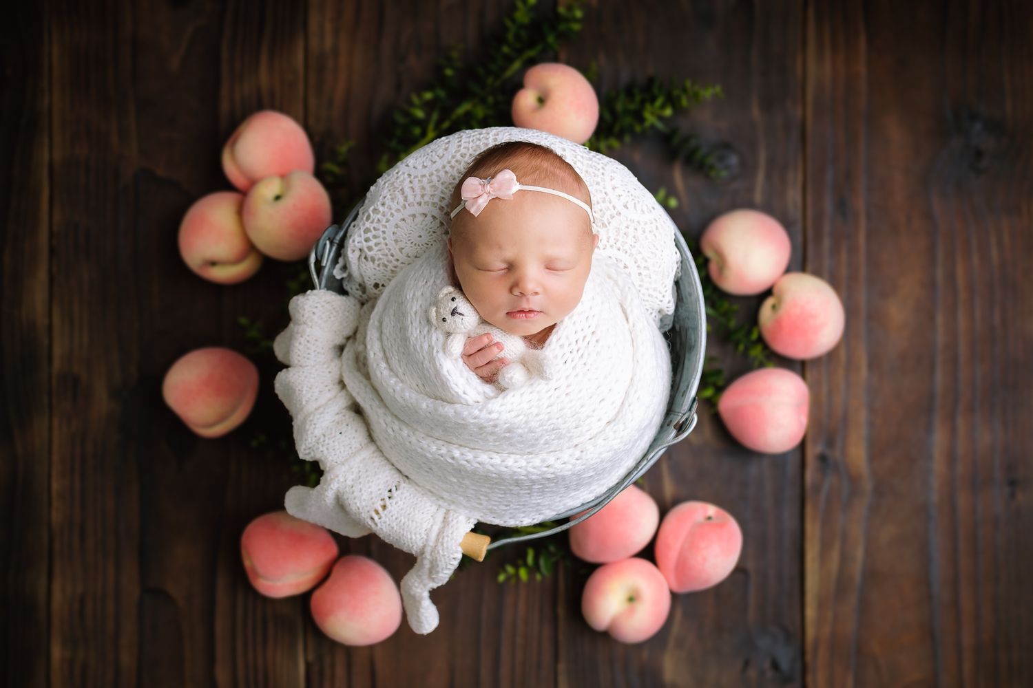 Peaceful styled newborn baby sleeping during an in-studio newborn photography session