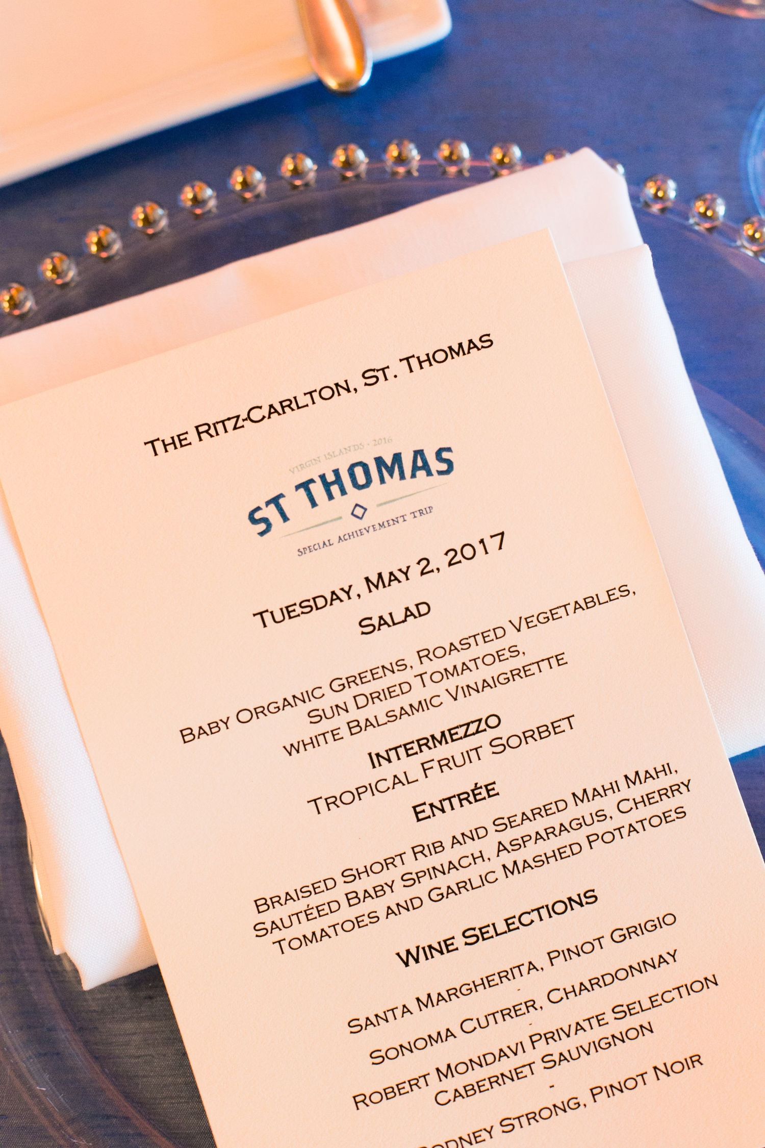 Ritz-Carlton St. Thomas dinner menu from May 2, 2017, featuring salad, intermezzo, entree, and wine selections.