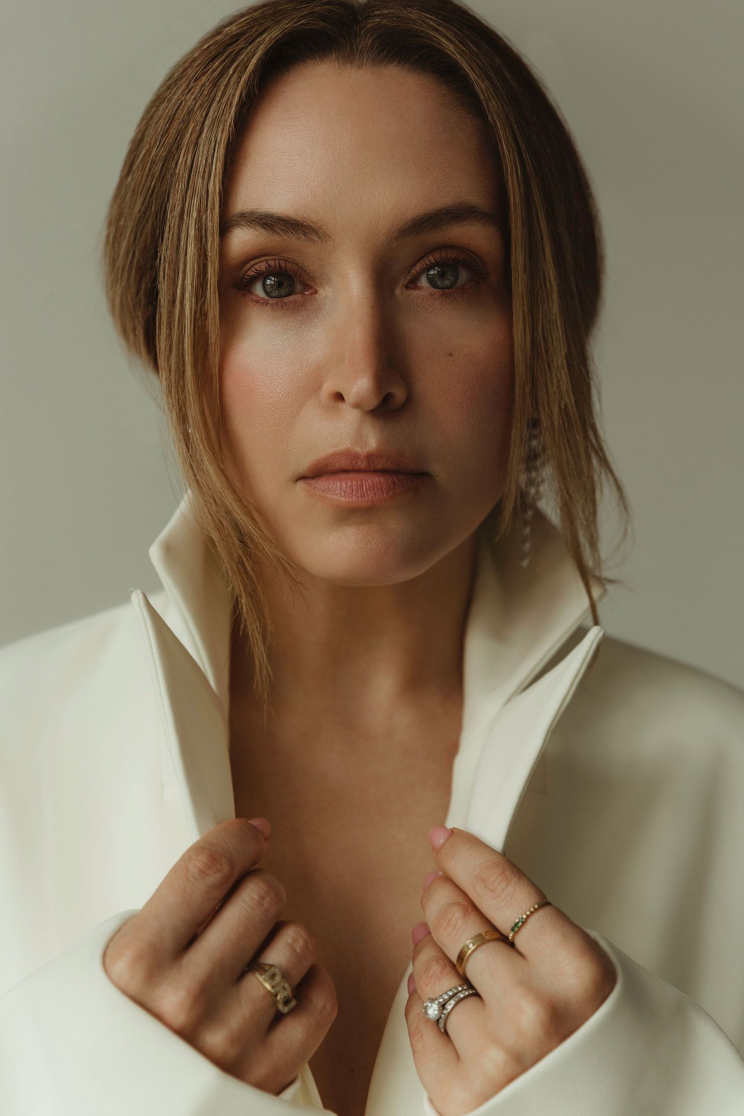 Serenbe fashion stylist Jessica Maney holds on to off white jacket lapel, Atlanta editorial portrait photographer