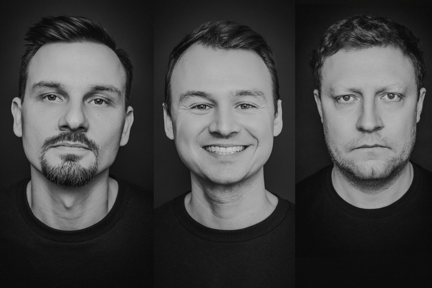 Black and white portrait of three men, two bald with glasses flanking a young man, against a white background.