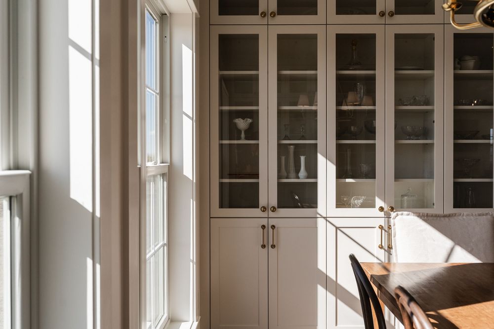 sunny dining area and shelving in kitchen