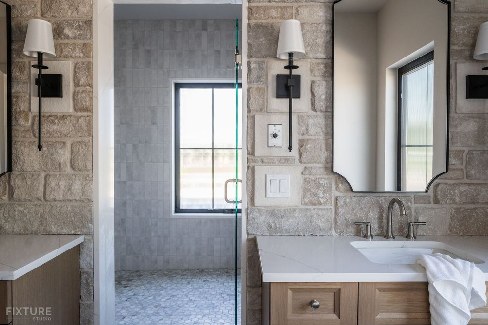 large bathroom shower and stone walls