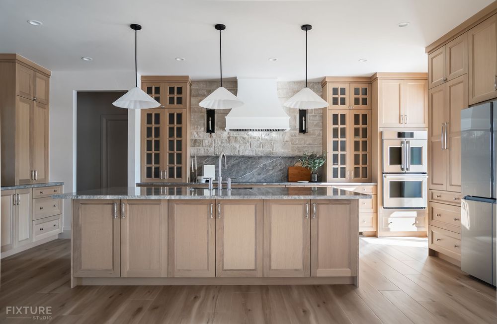 wide view of kitchen island and fixtures