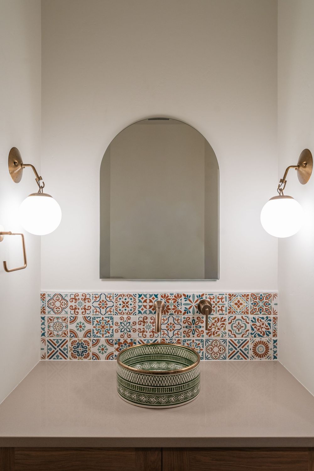 small bathroom with tile sink and wall