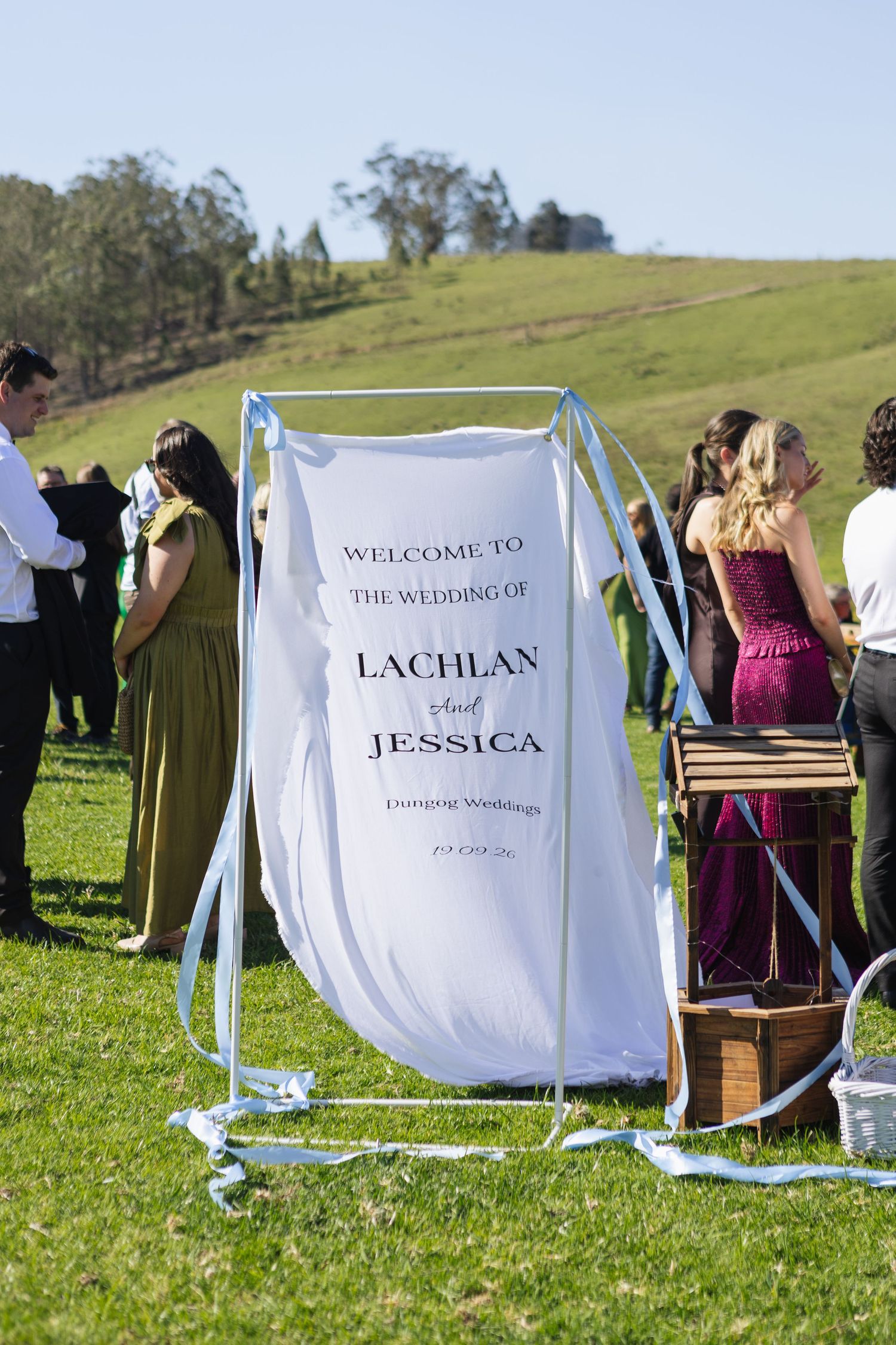 Jess and Lachie’s wedding ceremony signage overlooking the dam at Dungog Weddings