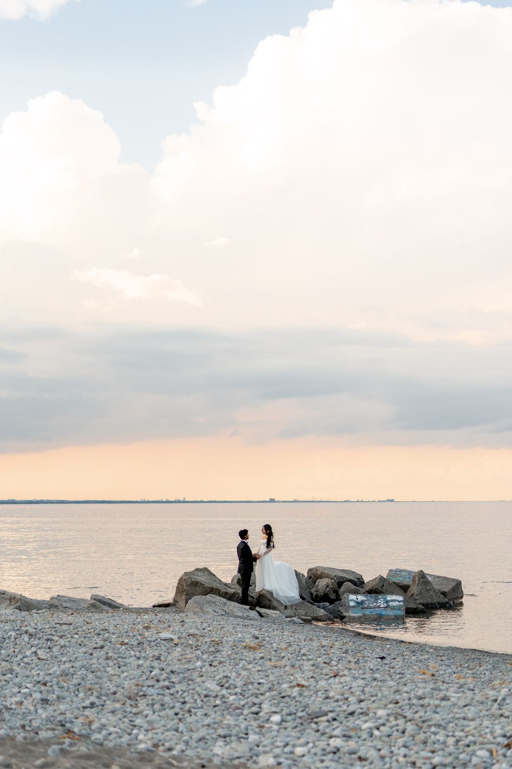 photos from lakeview by carmen's in hamilton, couple on the beach enjoying a candid moment