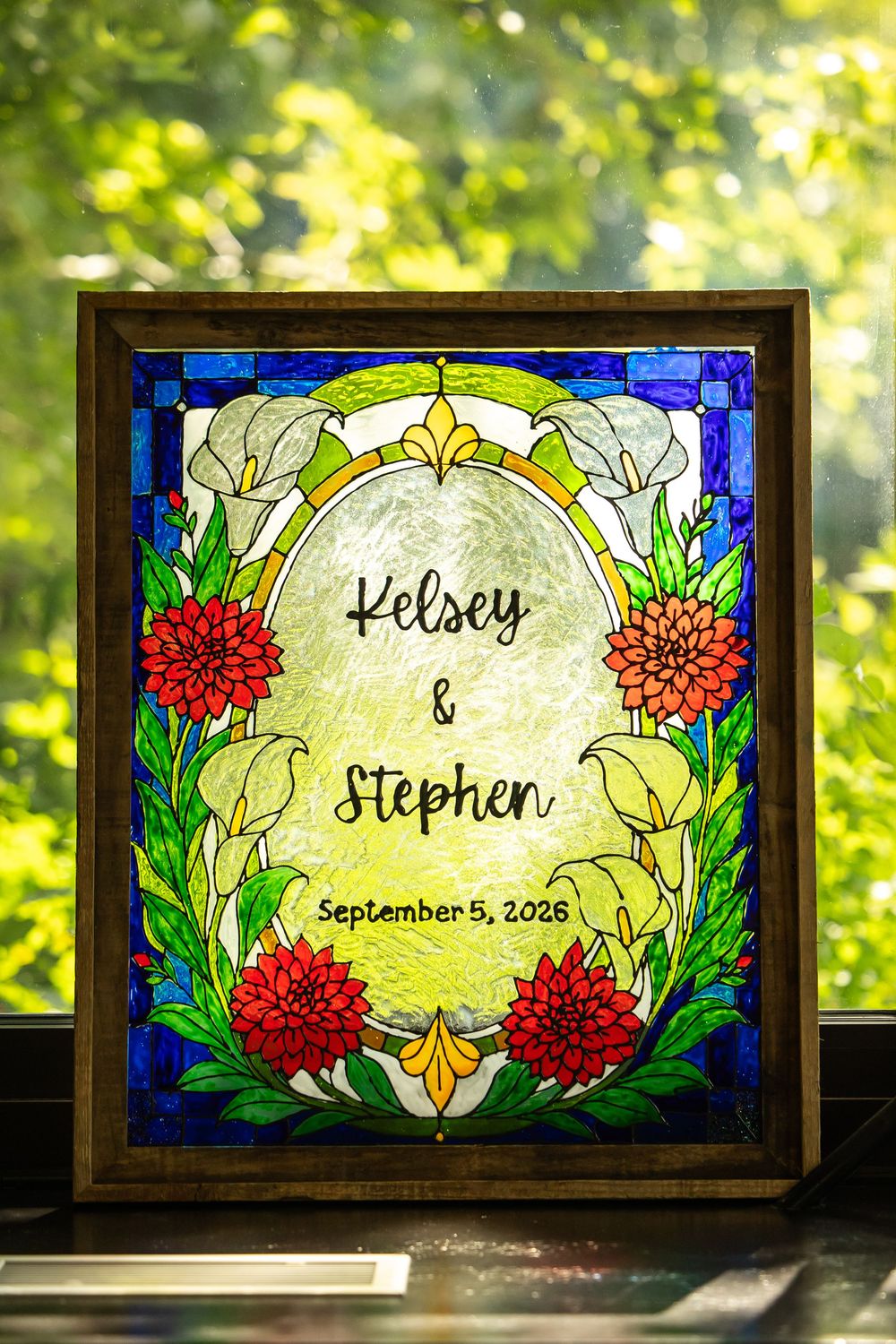 Custom stained glass wedding sign for Kelsey & Stephen, September 5, 2026, featuring calla lilies and red dahlias.