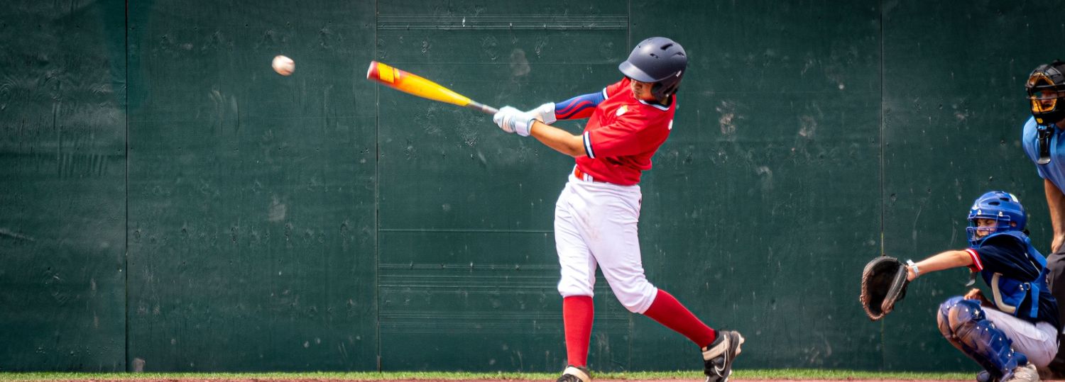 Baseball player hits a home run.