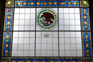 Stained glass window featuring the Mexican coat of arms with colorful border and Mexico label.
