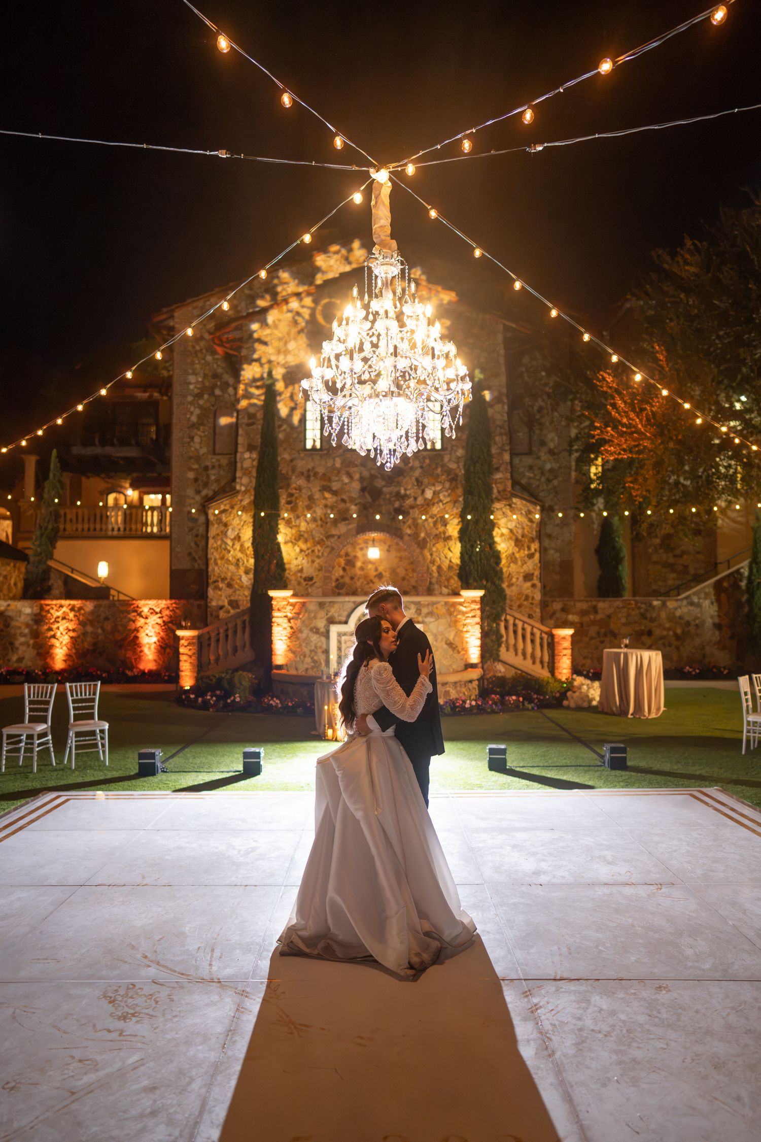 Bride grand entrance outdoor reception Bella Collina string lights Weddings by Ray