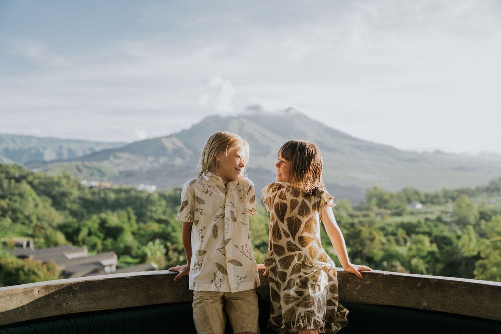 Family photography session with scenic Kintamani backdrop.