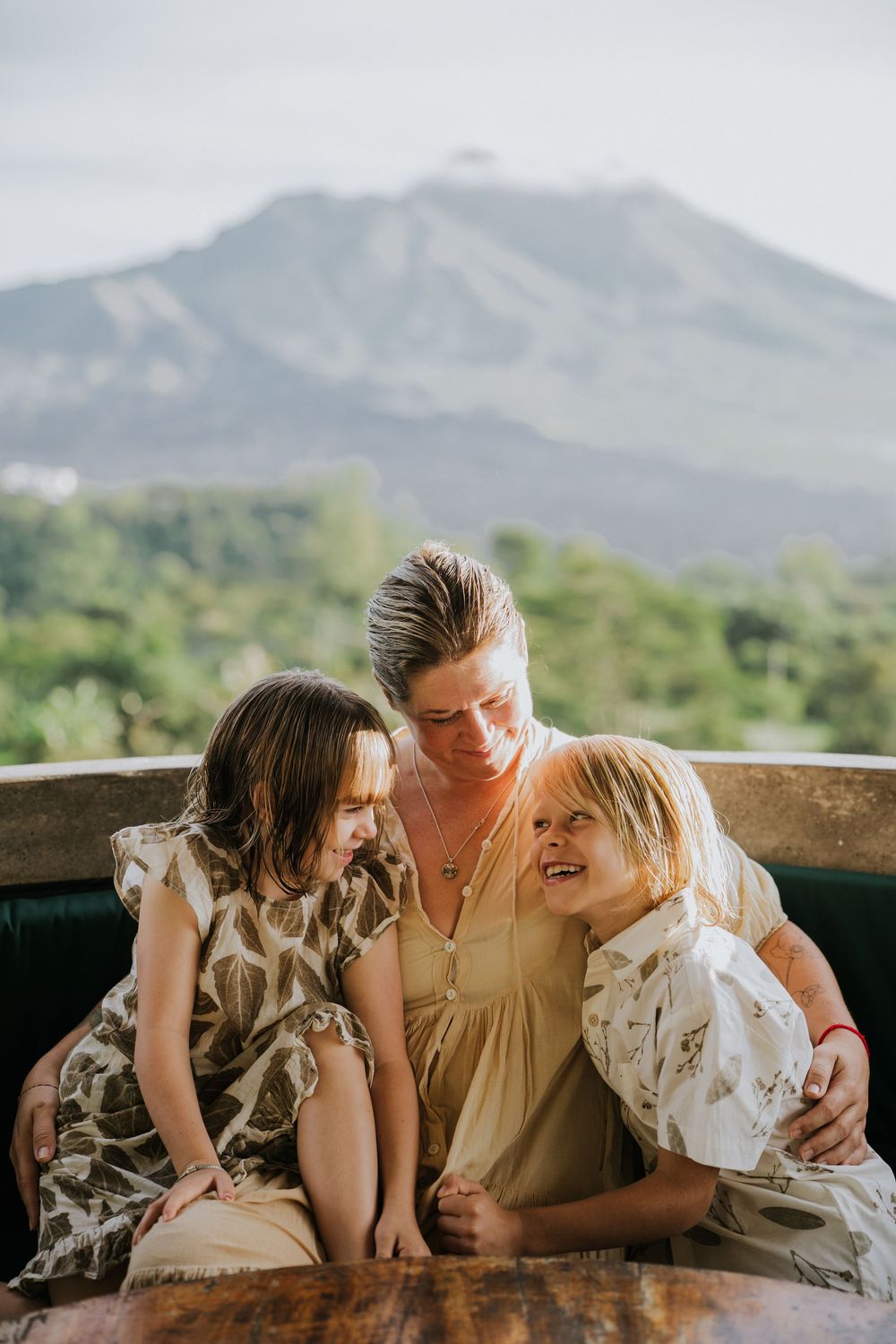 Family photography session with scenic Kintamani backdrop.
