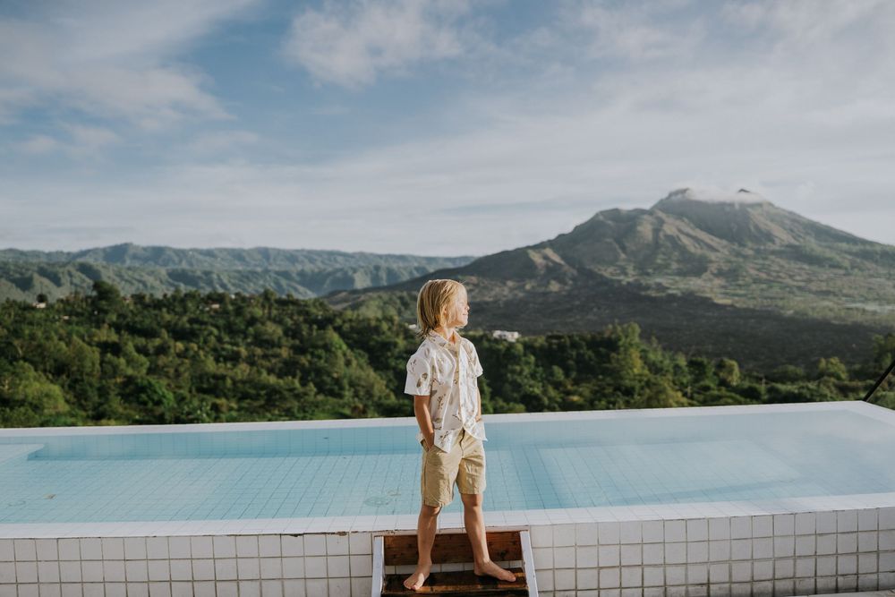 Family photography session with scenic Kintamani backdrop.