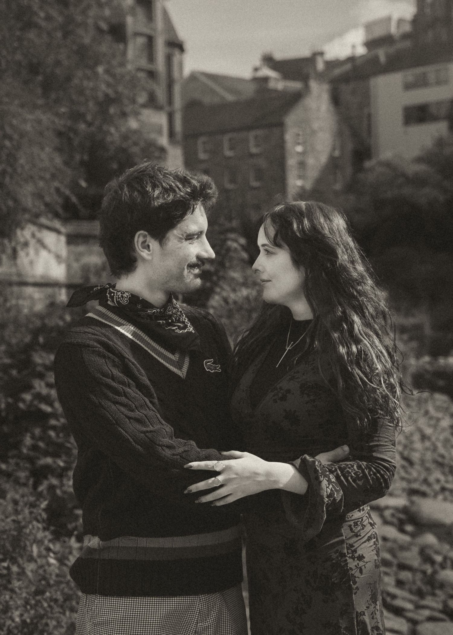 Black and white image of a couple in Dean Village Edinburgh, captured by a Scottish Love Story and Couples photographer