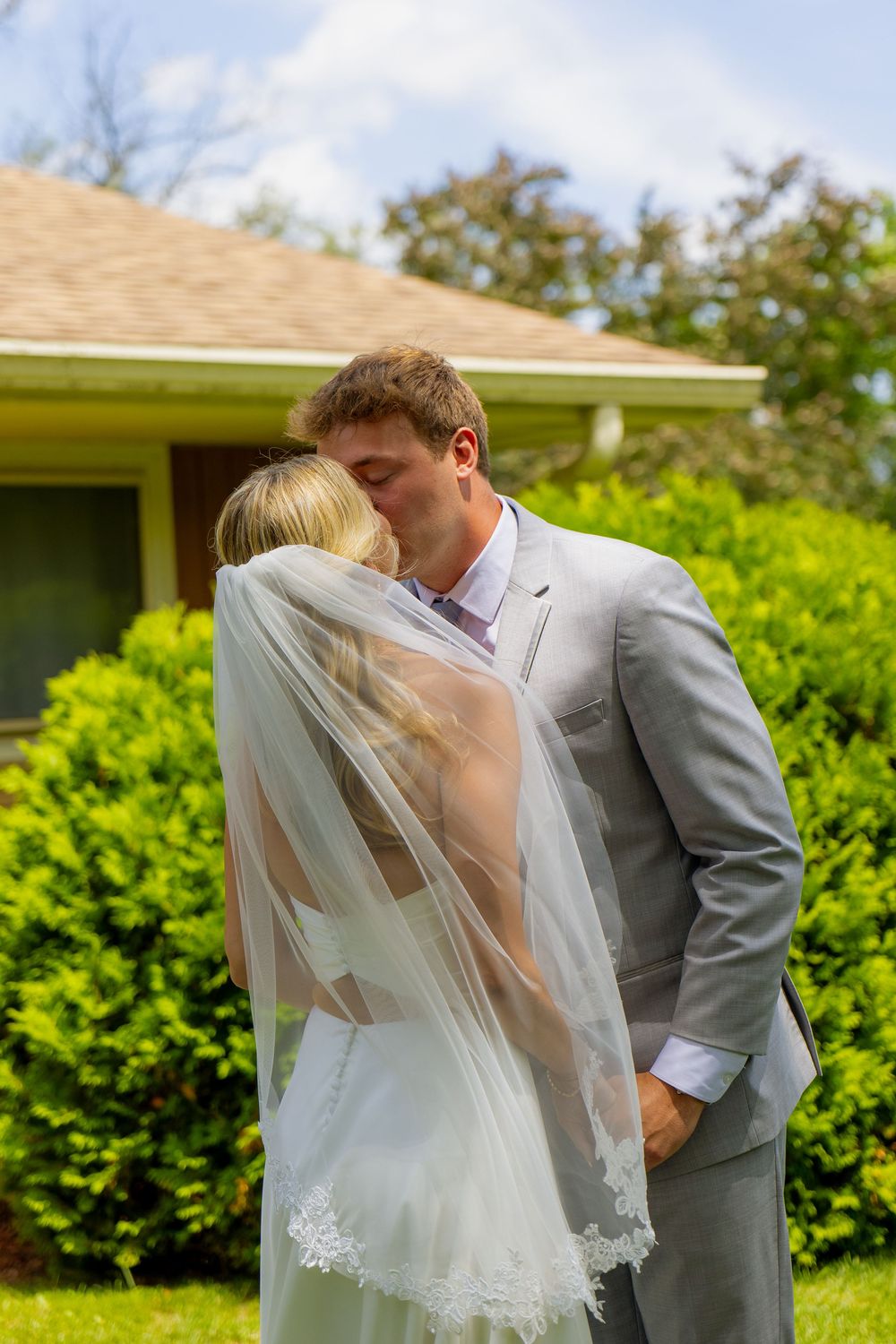 A bride and groom kiss