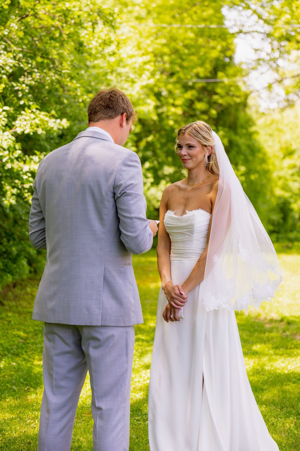 A bride smiling at her groom