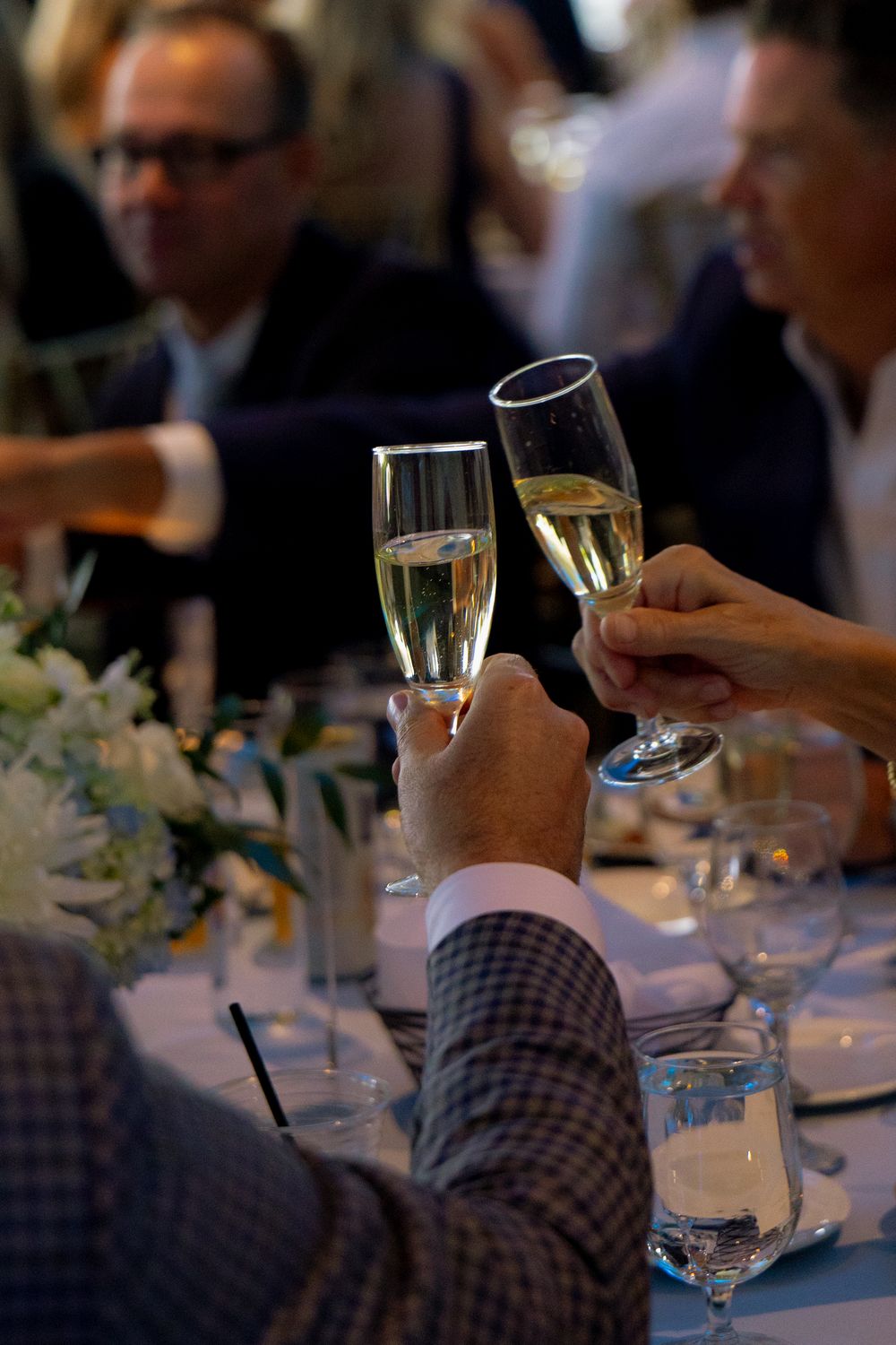 Two people making a toast at a wedding