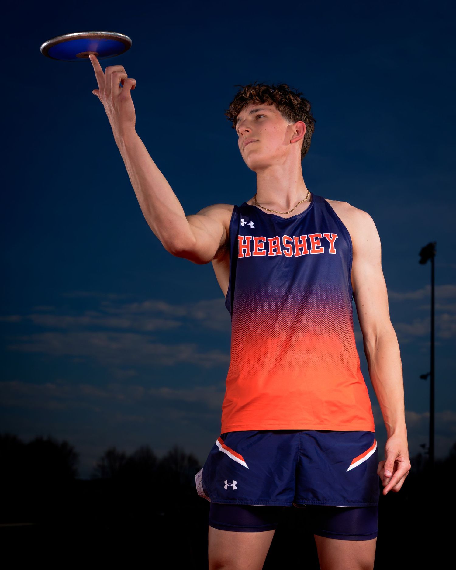 Hershey Trojans discus thrower portrait on photo day, by Deanna Fox, SportsFox Photography, Hershey PA