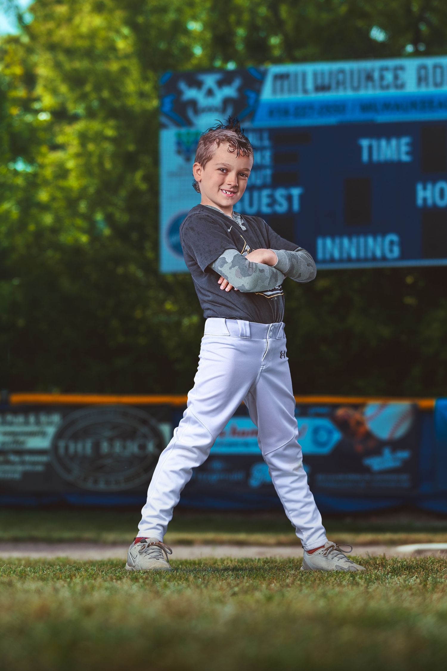 Edwin Hammen, Whitefish Bay River Bandits Little League baseball player, poses in uniform holding a bat.