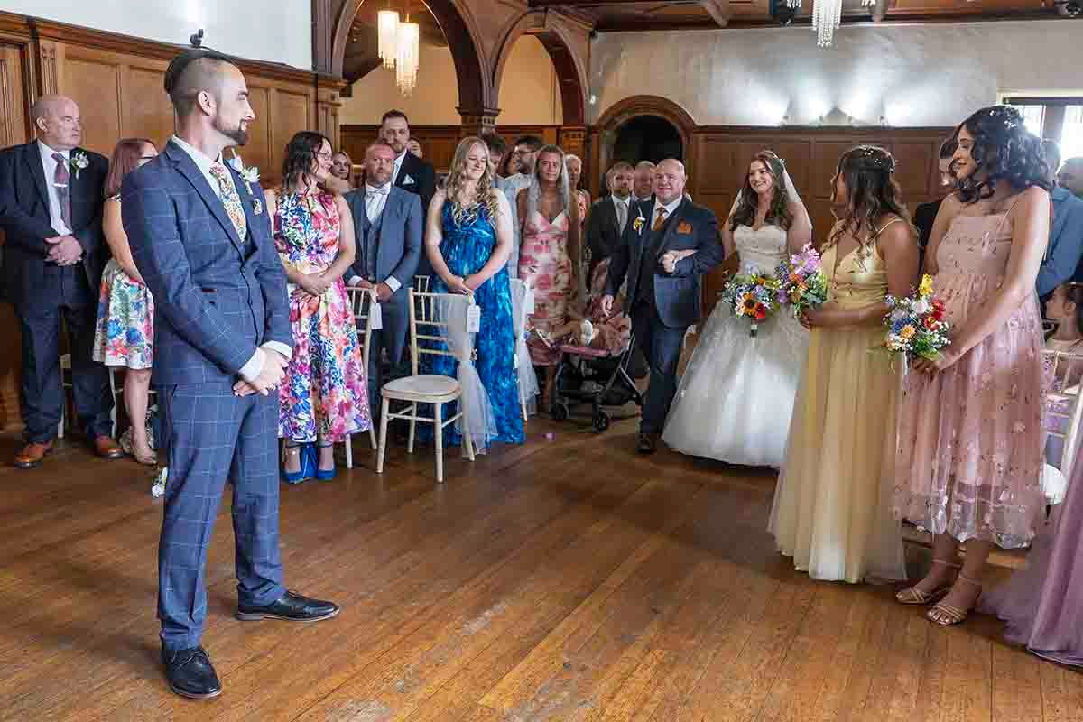 Groom sees the bride for the first time prior to being married at Dalston Hall -Cumbria's premier wedding venue