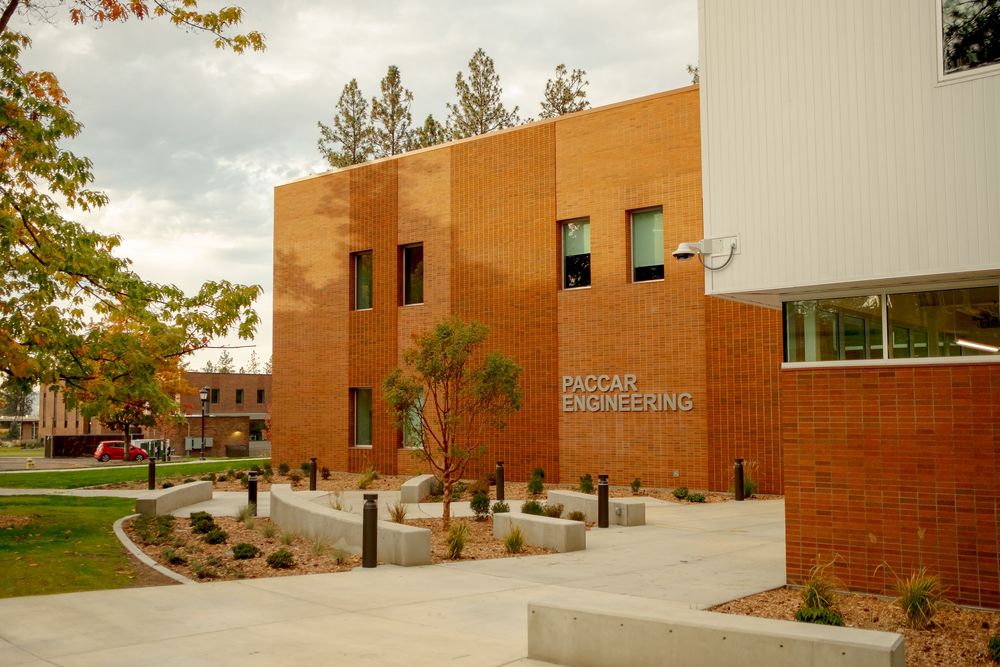 Exterior view of the PACCAR Engineering building at a university campus during autumn.