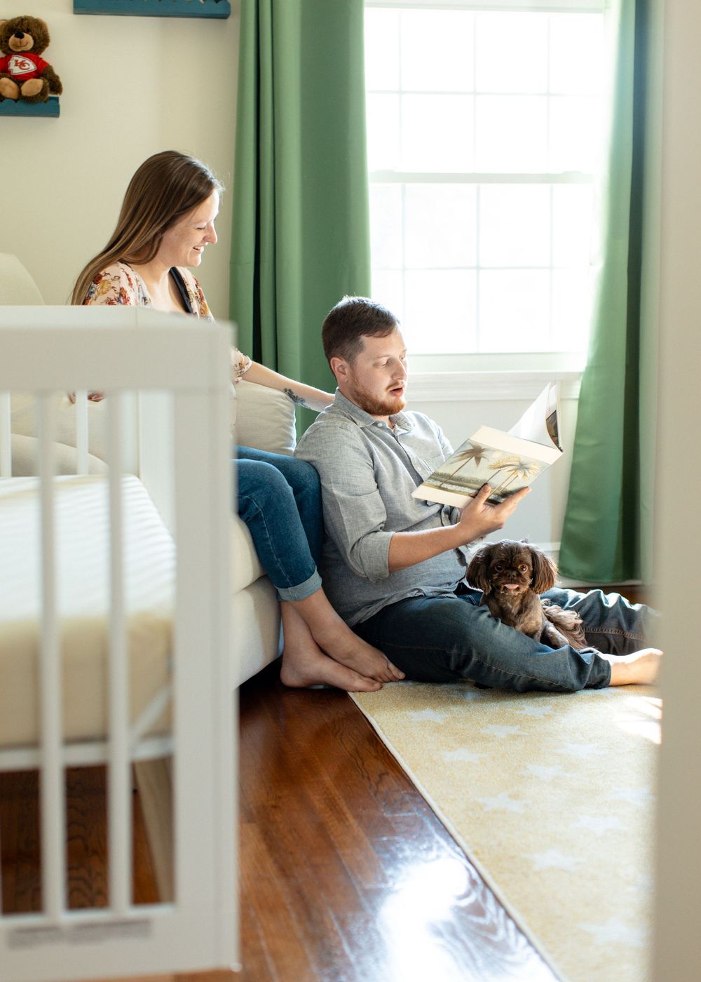 Moments in nursery during in-home, lifestyle maternity session in Flint, Michigan