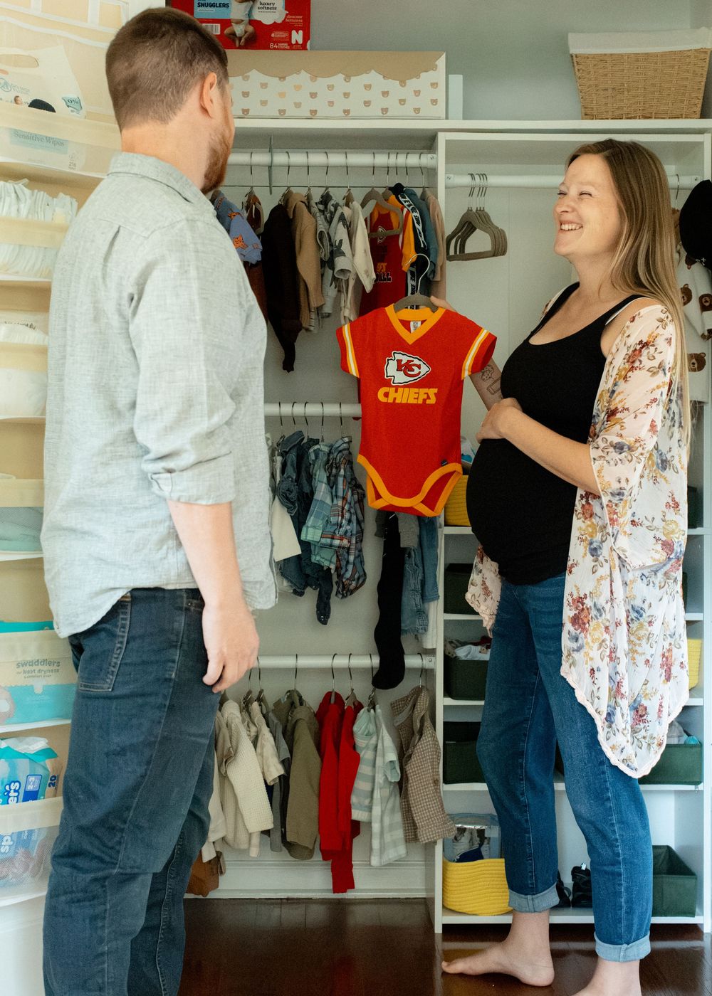 Kansas City Chiefs fans during their in-home maternity session in Flint, Michigan