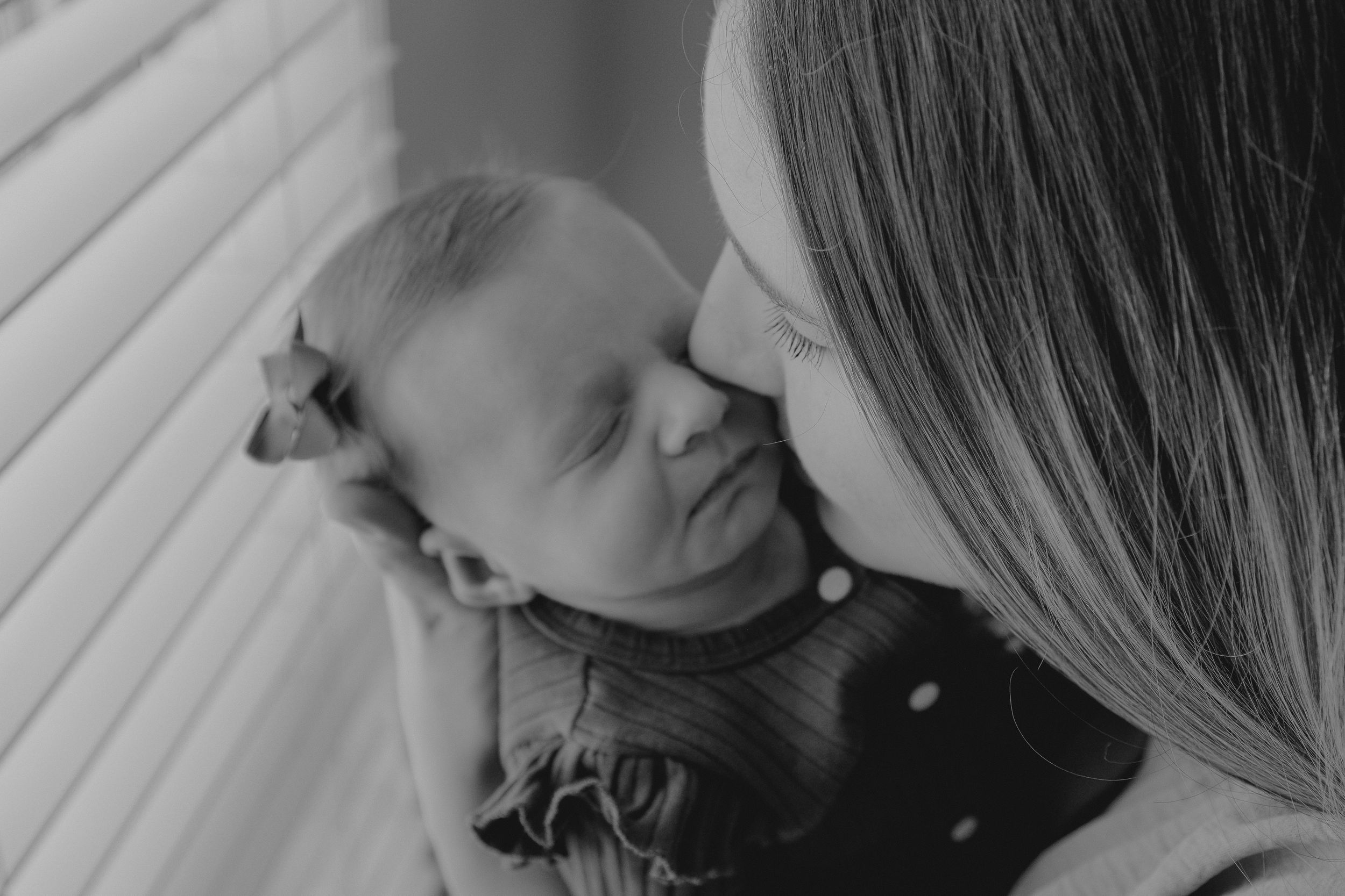 Family relaxing on sofa with newborn baby - Lifestyle newborn session by Gesiel Martins in Rochester Hills, MI