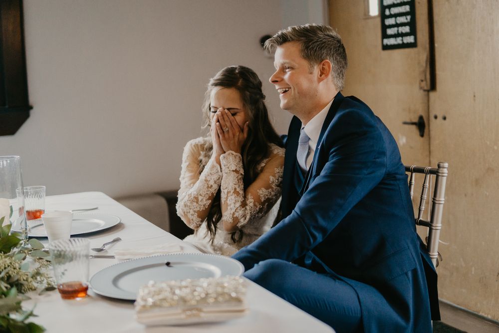groom laughing with brides before east tennessee wedding