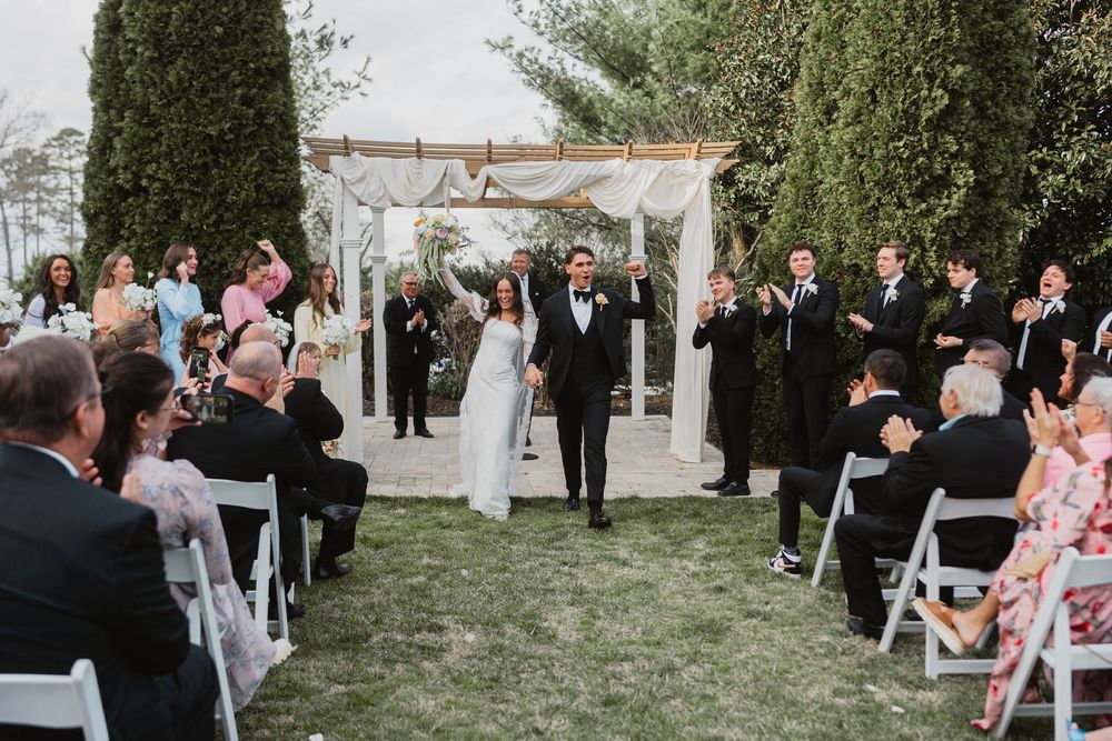 Bride and groom walking hand in hand, East Tennessee venue