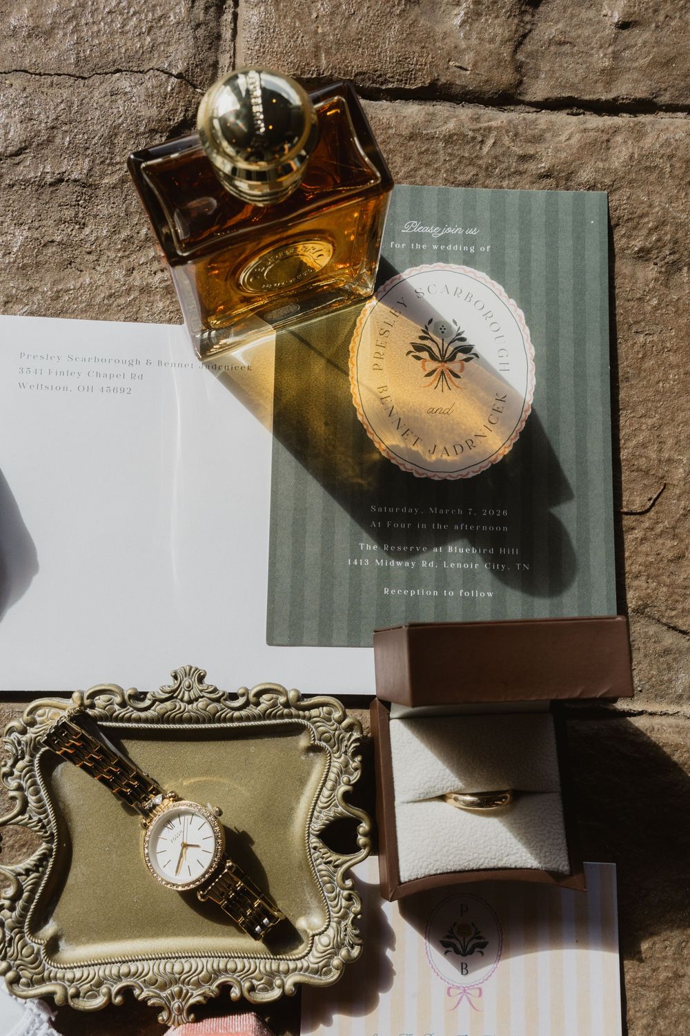 Detail shot of groom's cologne and invitation, golden hour, the reserve, gatlinburg tn