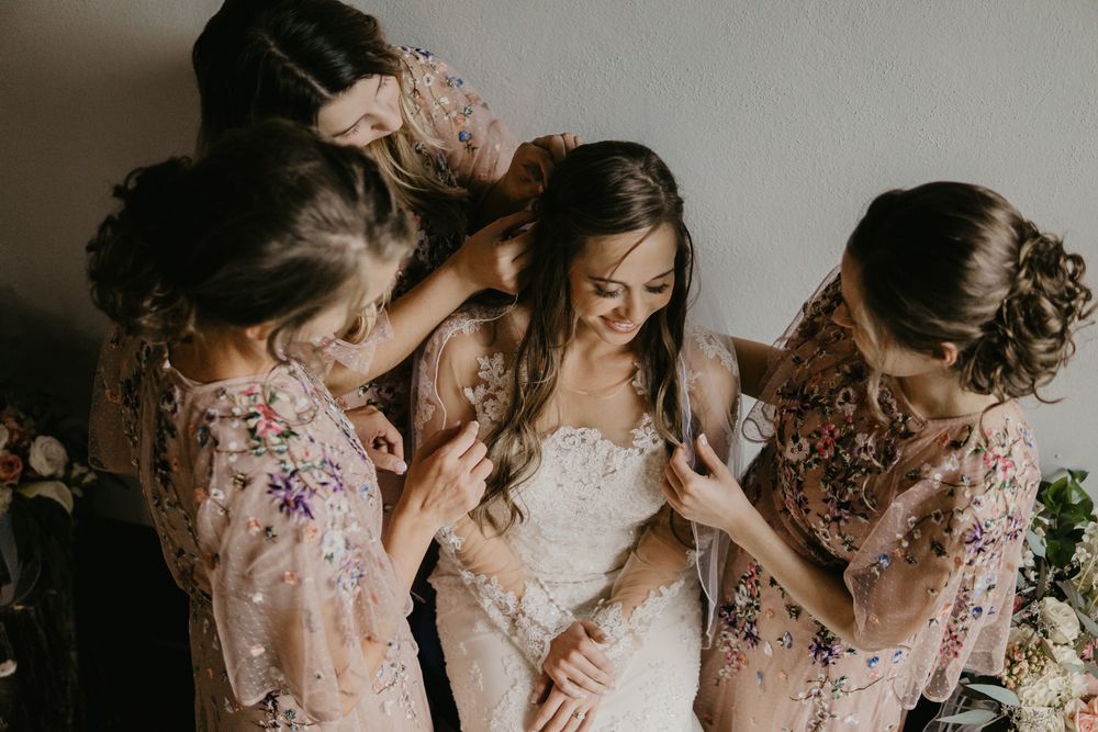 Bride laughing with bridesmaids before Maryville wedding
