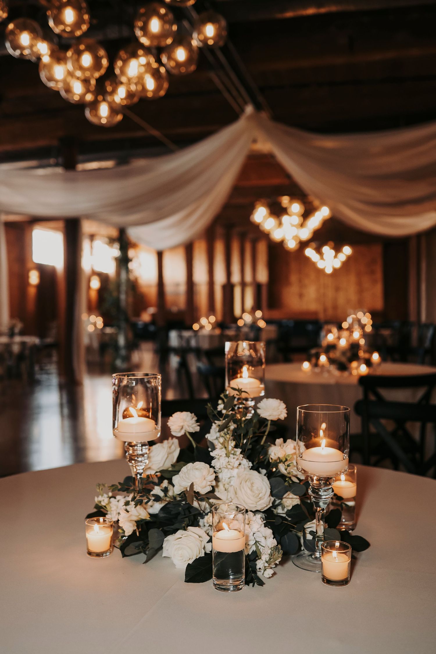 Wedding reception tables and decor inside The Cotton Mill McKinney